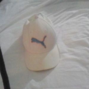 Puma One size fits most hat s/m fit, white w/ light blue puma with yellow outlin